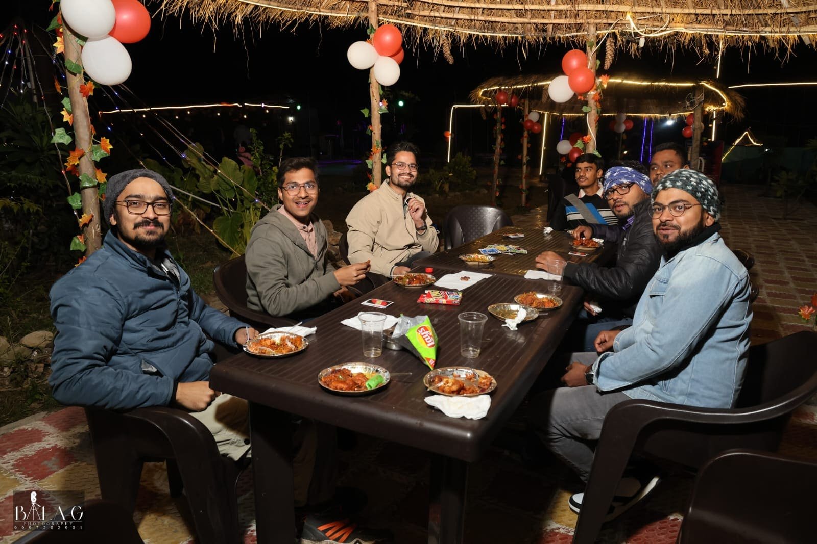 Group of friends enjoying drinks and snacks during a party at Shivadri Resort Café